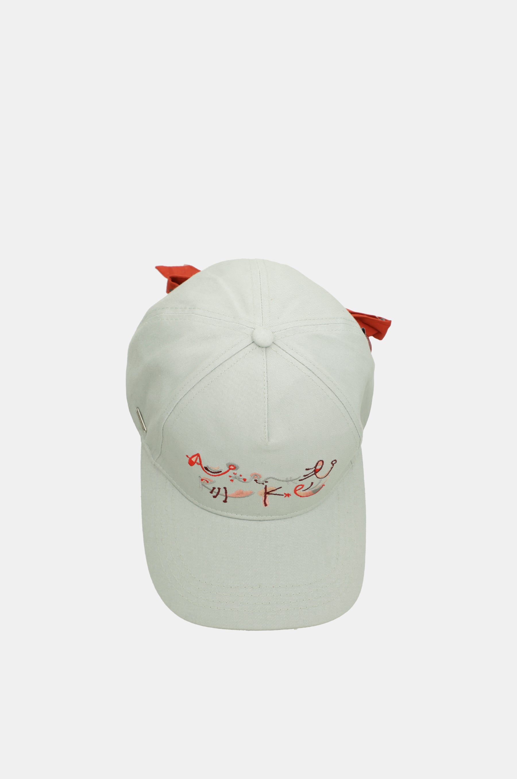 Gorra verde lazo rojo